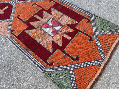 3x10 Herki Runner Rug: Vintage Handwoven Wool in Burnt Orange and Green Tribal Motifs
