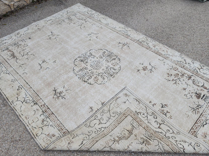 Vintage Oushak Wool Rug 7x10: Muted Medallion Turkish Design