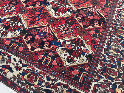 Vintage Bakhtiari Wool Rug 7x10 ft – Hand Knotted Persian Tribal Red Diamond Area Rug (1970s)- sku2101