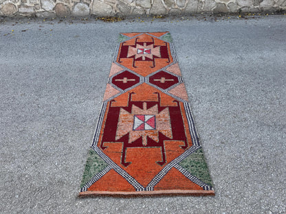 3x10 Herki Runner Rug: Vintage Handwoven Wool in Burnt Orange and Green Tribal Motifs