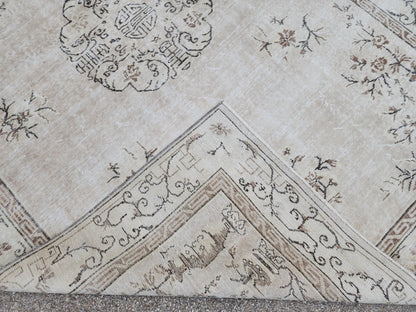 Vintage Oushak Wool Rug 7x10: Muted Medallion Turkish Design